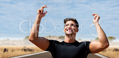 Composite image of portrait of happy sportsman