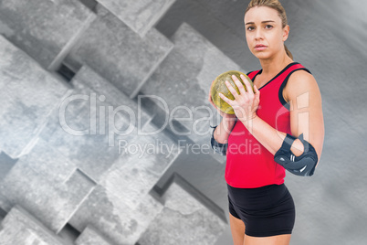 Composite image of female athlete with elbow pad holding handbal