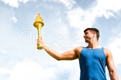 Composite image of low angle view of sportsman holding a cup