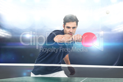 Composite image of portrait of male athlete playing table tennis