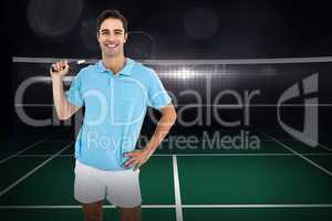 Composite image of badminton player standing with hand on hip