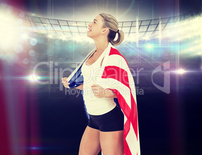 Composite image of female athlete with american flag on her shou