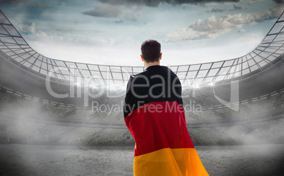 Composite image of rear view of athlete wearing German flag