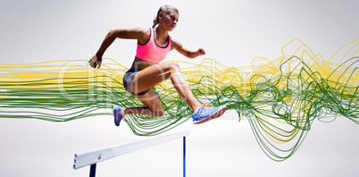 Composite image of sporty woman jumping a hurdle