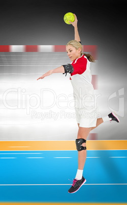 Composite image of sportswoman throwing a ball