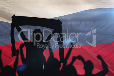 Composite image of silhouettes of football supporters