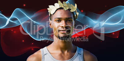 Composite image of portrait of victorious sportsman with crown o