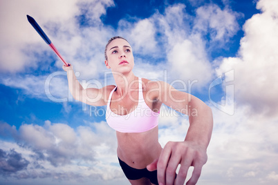 Composite image of female athlete throwing a javelin