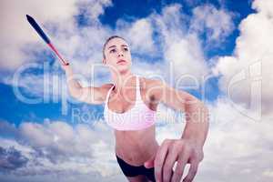 Composite image of female athlete throwing a javelin