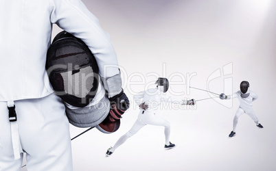 Composite image of rear view of swordsman holding fencing mask a
