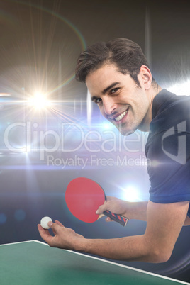 Composite image of portrait of happy male athlete playing table Composite image of portrait of happy male athlete playing table