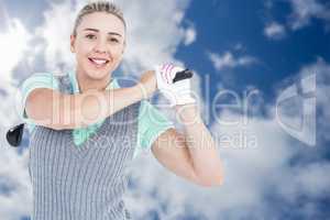 Composite image of pretty blonde playing golf