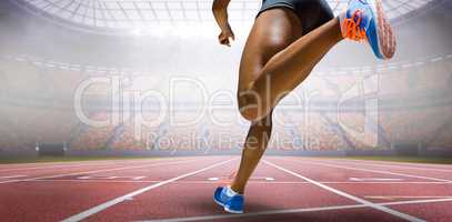 Composite image of sporty woman finishing her run