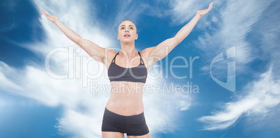 Composite image of female athlete raising arms