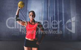 Composite image of female athlete with elbow pad holding handbal