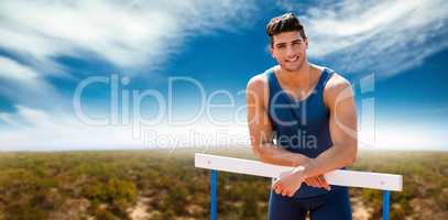 Composite image of portrait of sportsman is smiling and posing o