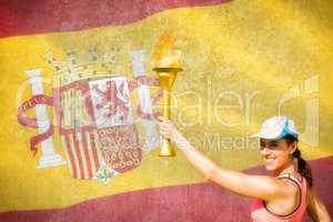 Composite image of happy woman raising a cup