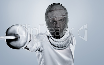 Composite image of man wearing fencing suit practicing with swor