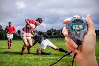 Close up of a hand holding a timer