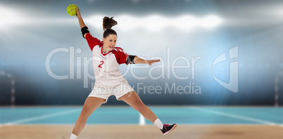 Composite image of sportswoman throwing a ball