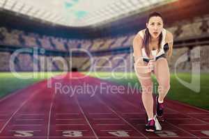 Composite image of athlete woman in ready to run position