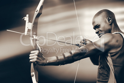 Composite image of side view of sportsman practising archery