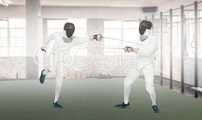 Composite image of man wearing fencing suit practicing with swor