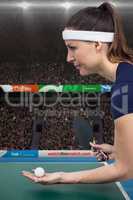 Composite image of female athlete playing table tennis