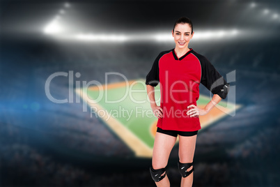 Female athlete posing with elbow pad and knee pad