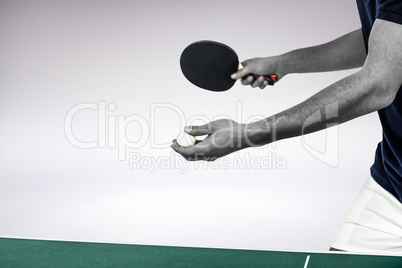 Composite image of male athlete playing table tennis