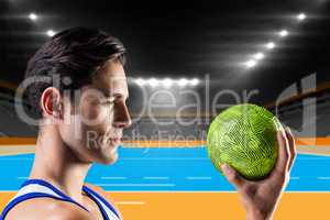 Composite image of confident athlete man holding a ball