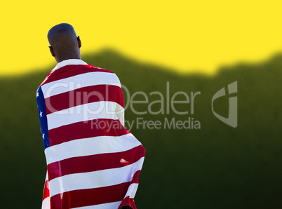 Man wearing american flag against blurred mountains