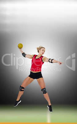 Female athlete with elbow pad throwing handball