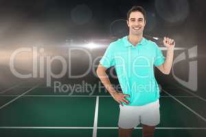 Composite image of badminton player standing with hand on hip