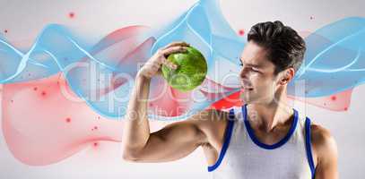 Composite image of happy male athlete holding a ball