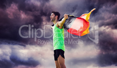 Composite image of man wearing german flag