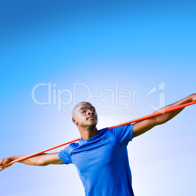 Composite image of sportsman with closed eyes preparing to javel