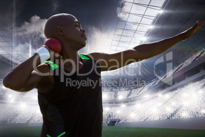 Composite image of profile view of sportsman practising shot put