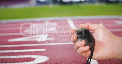 Close up of coach is holding a stopwatch