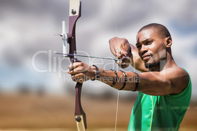 Composite image of close up view of man practicing archery