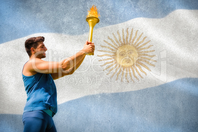 Composite image of low angle view of sportsman holding a cup