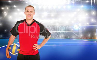 Composite image of sportsman holding a volleyball