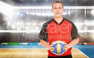 Composite image of sportsman holding a volleyball