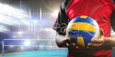 Composite image of mid-section of sportsman holding a volleyball