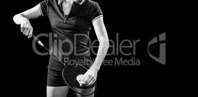 Badminton player holding a racquet ready to serve