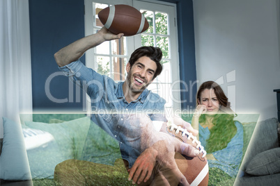 Composite image of man is watching american football match next