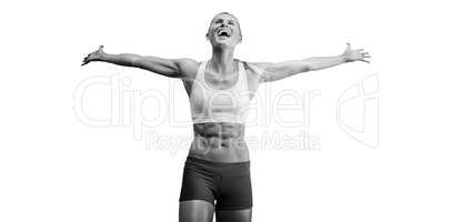 Fit woman celebrating victory with arms stretched