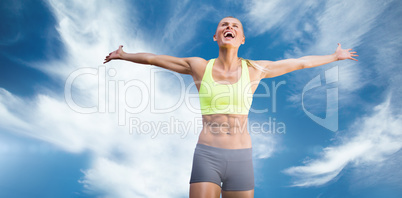 Composite image of fit woman celebrating victory with arms stret