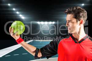 Composite image of confident athlete man holding a ball