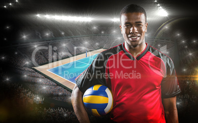 Composite image of sportsman holding a volleyball